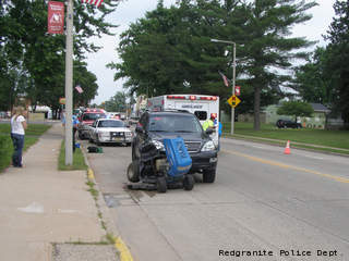 Emergency crews respond to a crash between an SUV and a lawn mower July 3, 2013 in Redgranite. Emergency crews respond to a crash between an SUV and a lawn mower July 3, 2013 in Redgranite.