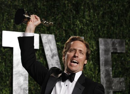 Nat Faxon holds his award for Best Adapted Screenplay for "The Descendants" at the 2012 Vanity Fair Oscar party in West Hollywood, Californi Nat Faxon holds his award for Best Adapted Screenplay for "The Descendants" at the 2012 Vanity Fair Oscar party in West Hollywood, Californi