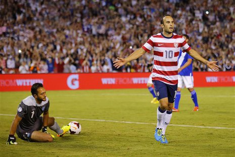 U.S. forward Landon Donovan (10) celebrates scoring against goalie Ricardo Jerez of Guatemala on a penalty kick during their friendly soccer U.S. forward Landon Donovan (10) celebrates scoring against goalie Ricardo Jerez of Guatemala on a penalty kick during their friendly soccer