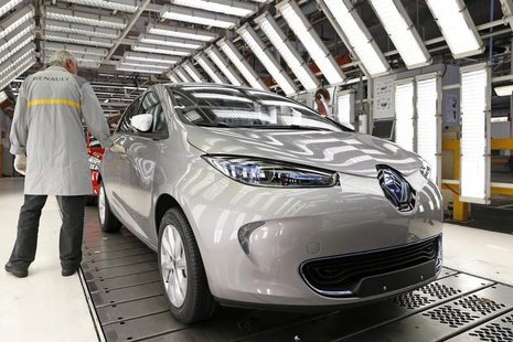 An employee inspects a Renault Zoe electric car on the production line at the Renault automobile factory in Flins, west of Paris, May 28, 20 An employee inspects a Renault Zoe electric car on the production line at the Renault automobile factory in Flins, west of Paris, May 28, 20