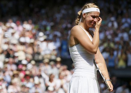 Sabine Lisicki of Germany cries as she is interviewed on Centre Court, after receiving her runners-up trophy, after being defeated by Marion Sabine Lisicki of Germany cries as she is interviewed on Centre Court, after receiving her runners-up trophy, after being defeated by Marion