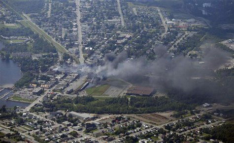 Smoke rises after a train explosion in the town Lac Megantic July 6, 2013. REUTERS/Mathieu Belanger (CANADA - Tags: DISASTER ENERGY) Smoke rises after a train explosion in the town Lac Megantic July 6, 2013. REUTERS/Mathieu Belanger (CANADA - Tags: DISASTER ENERGY)
