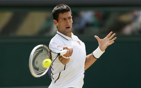 Novak Djokovic of Serbia hits a return to Juan Martin del Potro of Argentina during their men's semi-final tennis match at the Wimbledon Ten Novak Djokovic of Serbia hits a return to Juan Martin del Potro of Argentina during their men's semi-final tennis match at the Wimbledon Ten