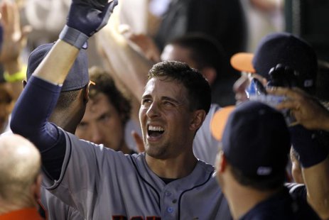 Houston Astros Jason Castro is congratulated by teammates after hitting a three-run home run against the Texas Rangers in the seventh inning Houston Astros Jason Castro is congratulated by teammates after hitting a three-run home run against the Texas Rangers in the seventh inning