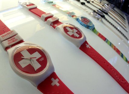 Swatch watches are displayed in front of a shop at the central station in Zurich February 4, 2013. REUTERS/Arnd Wiegmann Swatch watches are displayed in front of a shop at the central station in Zurich February 4, 2013. REUTERS/Arnd Wiegmann