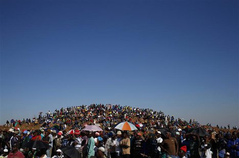 Striking miners evicted from company housing at a gold mine occupy a hill near the mine in Carltonville, west of Johannesburg, in this Octob Striking miners evicted from company housing at a gold mine occupy a hill near the mine in Carltonville, west of Johannesburg, in this Octob