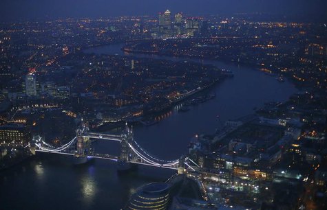 Tower Bridge and the Canary Wharf financial district (at rear) are seen at dusk in an aerial photograph from The View gallery at the Shard, Tower Bridge and the Canary Wharf financial district (at rear) are seen at dusk in an aerial photograph from The View gallery at the Shard,