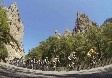 The pack of riders cycles on its way past the Gorges de Saint-Georges during the 195 km eighth stage of the centenary Tour de France cycling The pack of riders cycles on its way past the Gorges de Saint-Georges during the 195 km eighth stage of the centenary Tour de France cycling