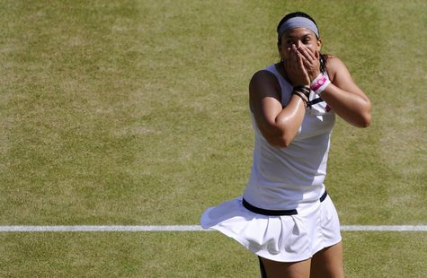 Marion Bartoli of France celebrates after defeating Sabine Lisicki of Germany in their women's singles final tennis match at the Wimbledon T Marion Bartoli of France celebrates after defeating Sabine Lisicki of Germany in their women's singles final tennis match at the Wimbledon T