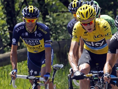 Race leader yellow jersey holder Team Sky rider Christopher Froome of Britain (R) and Team Saxo-Tinkoff rider Alberto Contador of Spain (L) Race leader yellow jersey holder Team Sky rider Christopher Froome of Britain (R) and Team Saxo-Tinkoff rider Alberto Contador of Spain (L)
