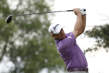 Northern Ireland's Graeme Mcdowell tees off on the second hole during the first round of the 2013 U.S. Open golf championship at the Merion Northern Ireland's Graeme Mcdowell tees off on the second hole during the first round of the 2013 U.S. Open golf championship at the Merion