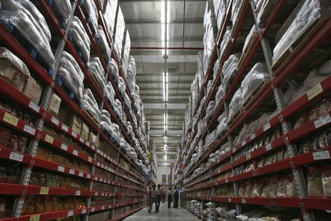 Workers walk inside an aisle of the newly opened Bharti Wal-Mart Best Price Modern wholesale store in the southern Indian city of Hyderabad Workers walk inside an aisle of the newly opened Bharti Wal-Mart Best Price Modern wholesale store in the southern Indian city of Hyderabad