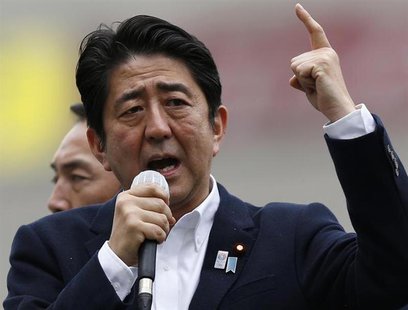 Japan's Prime Minister Shinzo Abe, who is also leader of the ruling Liberal Democratic Party, speaks to voters atop a campaign van in Tokyo Japan's Prime Minister Shinzo Abe, who is also leader of the ruling Liberal Democratic Party, speaks to voters atop a campaign van in Tokyo