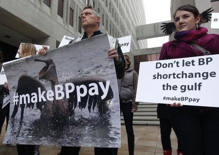 Activists protest in front of the Hale Boggs Federal Building on the first day of the trial over the Deepwater Horizon oil rig spill in New Activists protest in front of the Hale Boggs Federal Building on the first day of the trial over the Deepwater Horizon oil rig spill in New