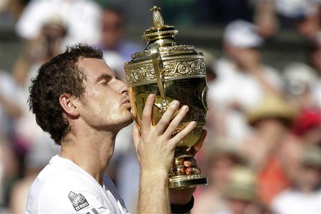 Andy Murray of Britain kisses the winners trophy after defeating Novak Djokovic of Serbia (R) in their men's singles final tennis match at t Andy Murray of Britain kisses the winners trophy after defeating Novak Djokovic of Serbia (R) in their men's singles final tennis match at t