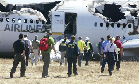 U.S. National Transportation Safety Board (NTSB) investigators work at the scene of the Asiana Airlines Flight 214 crash site at San Francis U.S. National Transportation Safety Board (NTSB) investigators work at the scene of the Asiana Airlines Flight 214 crash site at San Francis