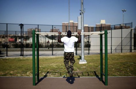 A man works out in an outdoor exercise area at Macombs Dam Park in the Bronx section of New York City, September 13, 2012. REUTERS/Mike Sega A man works out in an outdoor exercise area at Macombs Dam Park in the Bronx section of New York City, September 13, 2012. REUTERS/Mike Sega
