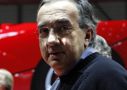 Fiat CEO Sergio Marchionne poses after the presentation of the new LaFerrari hybrid car on the Ferrari stand during the first media day of t Fiat CEO Sergio Marchionne poses after the presentation of the new LaFerrari hybrid car on the Ferrari stand during the first media day of t