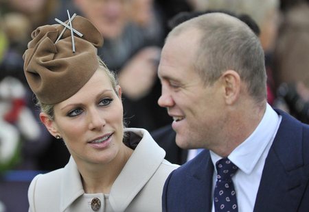 Britain's Zara Phillips (L) and her husband Mike Tindall walk to St. Mary's church to attend the annual Christmas service on the Royal Estat Britain's Zara Phillips (L) and her husband Mike Tindall walk to St. Mary's church to attend the annual Christmas service on the Royal Estat