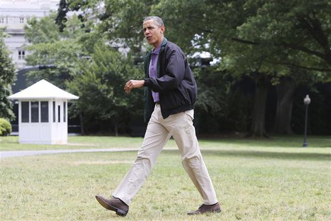 U.S. President Barack Obama walks across the South Lawn as he returns via Marine One helicopter from a weekend visit at Camp David to the Wh U.S. President Barack Obama walks across the South Lawn as he returns via Marine One helicopter from a weekend visit at Camp David to the Wh