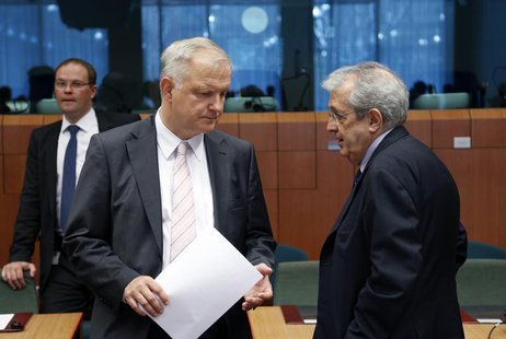 European Economic and Monetary Affairs Commissioner Olli Rehn listens to Italy's Economy Minister Fabrizio Saccomanni (R) during an euro zon European Economic and Monetary Affairs Commissioner Olli Rehn listens to Italy's Economy Minister Fabrizio Saccomanni (R) during an euro zon