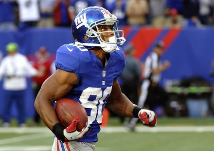 New York Giants Victor Cruz watches the scoreboard as he runs for the game winning touchdown against the Washington Redskins in the fourth q New York Giants Victor Cruz watches the scoreboard as he runs for the game winning touchdown against the Washington Redskins in the fourth q
