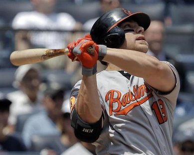 Baltimore Orioles batter Chris Davis watches the ball as he hits a two-run home run against the New York Yankees in the first inning of thei Baltimore Orioles batter Chris Davis watches the ball as he hits a two-run home run against the New York Yankees in the first inning of thei