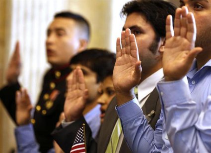Candidates swear in as United States citizens during a Special Naturalization Ceremony for 30 U.S. citizen candidates in the Cash Room at th Candidates swear in as United States citizens during a Special Naturalization Ceremony for 30 U.S. citizen candidates in the Cash Room at th