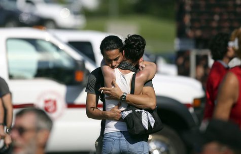 A man console his friend at the Polyvanlente Montignac, the school sheltering the people who were forced to leave their houses after the exp A man console his friend at the Polyvanlente Montignac, the school sheltering the people who were forced to leave their houses after the exp
