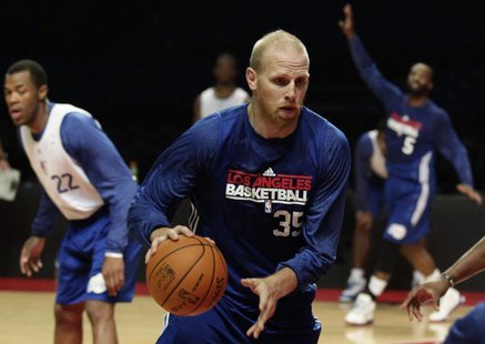 File photo of Chris Kaman (C) controlling the ball during a practice session in Mexico City October 11, 2010. REUTERS/Henry Romero File photo of Chris Kaman (C) controlling the ball during a practice session in Mexico City October 11, 2010. REUTERS/Henry Romero