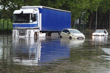 Cars and a lorry are blocked on a street after a heavy thunderstorm with rain caused local flooding in Aulnay sous Bois near Paris, June 19, Cars and a lorry are blocked on a street after a heavy thunderstorm with rain caused local flooding in Aulnay sous Bois near Paris, June 19,