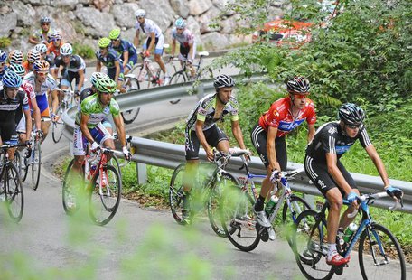 Team Sky rider Chris Froome of Britain (R), Team Sky rider Bradley Wiggins of Britain (2nd R), Geox TMC rider Juan Jose Cobo of Spain (3rd R Team Sky rider Chris Froome of Britain (R), Team Sky rider Bradley Wiggins of Britain (2nd R), Geox TMC rider Juan Jose Cobo of Spain (3rd R