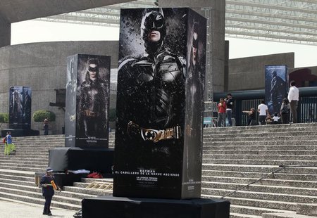 Posters of the film "The Dark Knight Rises" are displayed outside as people wait for the midnight premiere of the final instalment of Christ Posters of the film "The Dark Knight Rises" are displayed outside as people wait for the midnight premiere of the final instalment of Christ