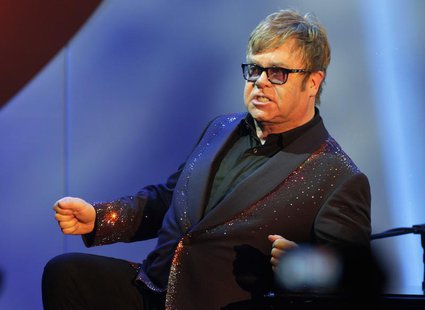 Musician Elton John acknowledges the audience during his performance at the 20th Annual Race to Erase MS benefit gala in Los Angeles May 3, Musician Elton John acknowledges the audience during his performance at the 20th Annual Race to Erase MS benefit gala in Los Angeles May 3,