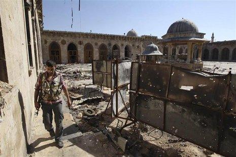 A Free Syrian Army fighter walks inside the Grand Umayyad mosque in Aleppo July 8, 2013. Picture taken July 8, 2013. REUTERS/Muzaffar Salman A Free Syrian Army fighter walks inside the Grand Umayyad mosque in Aleppo July 8, 2013. Picture taken July 8, 2013. REUTERS/Muzaffar Salman
