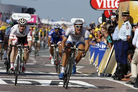 Argos-Shimano team rider Marcel Kittel of Germany crosses the finish line to win the 197 km tenth stage of the centenary Tour de France cycl Argos-Shimano team rider Marcel Kittel of Germany crosses the finish line to win the 197 km tenth stage of the centenary Tour de France cycl