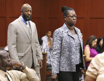 The parents of Trayvon Martin, Tracy Martin and Sybrina Fulton, arrive in the courtroom for the George Zimmerman trial in Seminole circuit c The parents of Trayvon Martin, Tracy Martin and Sybrina Fulton, arrive in the courtroom for the George Zimmerman trial in Seminole circuit c