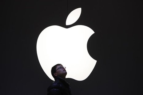 A man stands in front of an Apple logo in downtown Shanghai February 18, 2012. REUTERS/Aly Song A man stands in front of an Apple logo in downtown Shanghai February 18, 2012. REUTERS/Aly Song