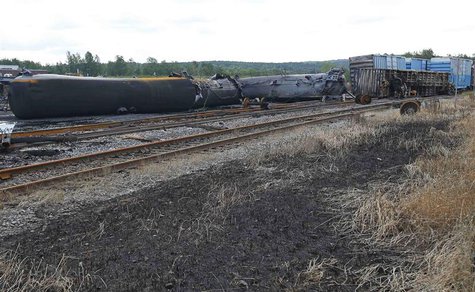 Wagons of the train wreck are seen in Lac Megantic, July 9, 2013. REUTERS/Mathieu Belanger Wagons of the train wreck are seen in Lac Megantic, July 9, 2013. REUTERS/Mathieu Belanger