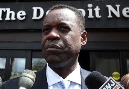 Detroit's Emergency Financial Manager Kevyn Orr talks to members of the media outside the Detroit Newspapers building about the report he de Detroit's Emergency Financial Manager Kevyn Orr talks to members of the media outside the Detroit Newspapers building about the report he de