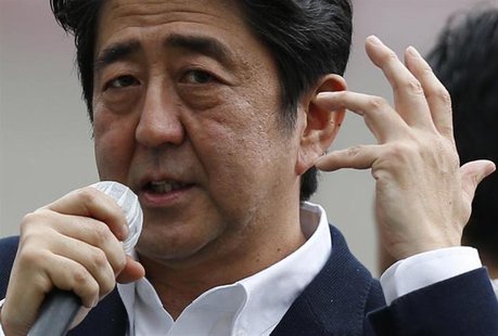 Japan's Prime Minister Shinzo Abe, who is also leader of the ruling Liberal Democratic Party, speaks to voters during a campaign for the Jul Japan's Prime Minister Shinzo Abe, who is also leader of the ruling Liberal Democratic Party, speaks to voters during a campaign for the Jul
