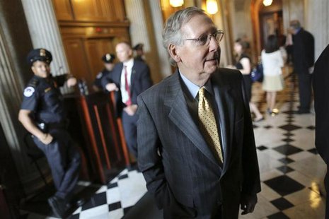 U.S. Senate Minority Leader Mitch McConnell (R-KY) walks to lunch after a procedural vote to move forward on immigration reform legislation U.S. Senate Minority Leader Mitch McConnell (R-KY) walks to lunch after a procedural vote to move forward on immigration reform legislation
