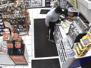 This still frame taken from surveillance video shows a man allegedly taking a wallet from the counter of a convenience store in the 1200 block of W. Wisconsin Ave. in Appleton, July 5, 2013. This still frame taken from surveillance video shows a man allegedly taking a wallet from the counter of a convenience store in the 1200 block of W. Wisconsin Ave. in Appleton, July 5, 2013.