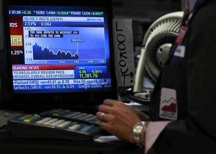 A trader works on the floor of the New York Stock Exchange as The Federal Reserve rate announcement is shown on a screen, November 3, 2010. A trader works on the floor of the New York Stock Exchange as The Federal Reserve rate announcement is shown on a screen, November 3, 2010.