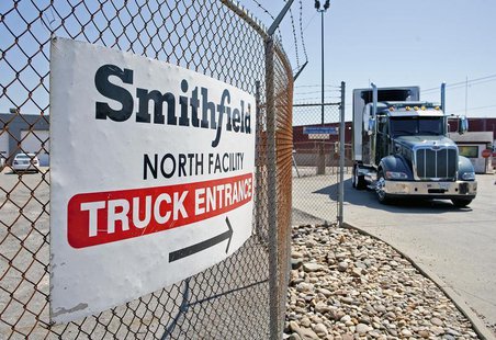 Trucks make their way around the Smithfield Foods packaging plant in Smithfield, Virginia May 30, 2013. REUTERS/Rich-Joseph Facun Trucks make their way around the Smithfield Foods packaging plant in Smithfield, Virginia May 30, 2013. REUTERS/Rich-Joseph Facun