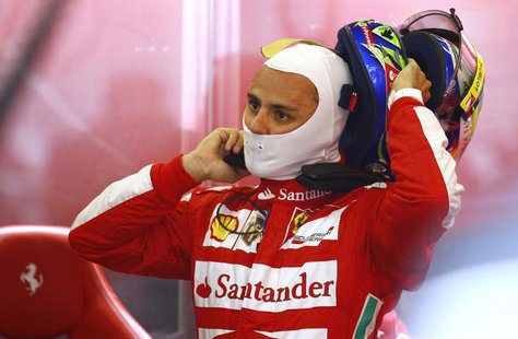 Ferrari Formula One driver Felipe Massa of Brazil takes off his helmet after the first practice session of the German F1 Grand Prix at the N Ferrari Formula One driver Felipe Massa of Brazil takes off his helmet after the first practice session of the German F1 Grand Prix at the N