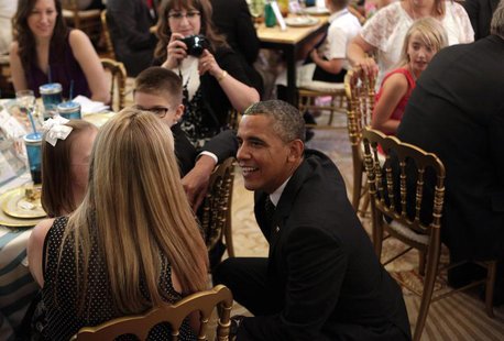 U.S. President Barack Obama greets guests at the second annual "Kids' State Dinner", to honor the winners of a nationwide recipe challenge t U.S. President Barack Obama greets guests at the second annual "Kids' State Dinner", to honor the winners of a nationwide recipe challenge t