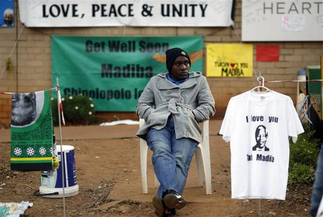 A street vendor sells t-shirts and fabric outside the hospital where ailing former President Nelson Mandela is being treated in Pretoria, Ju A street vendor sells t-shirts and fabric outside the hospital where ailing former President Nelson Mandela is being treated in Pretoria, Ju