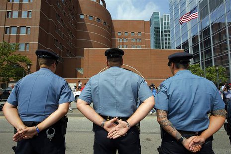 Massachusetts Institute of Technology (MIT) police officers stand outside the federal courthouse for the court appearance by accused Boston Massachusetts Institute of Technology (MIT) police officers stand outside the federal courthouse for the court appearance by accused Boston