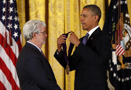 REFILE - ADDITIONAL INFORMATION U.S. President Barack Obama (R) awards the 2012 National Medal of Arts to film producer George Lucas during REFILE - ADDITIONAL INFORMATION U.S. President Barack Obama (R) awards the 2012 National Medal of Arts to film producer George Lucas during